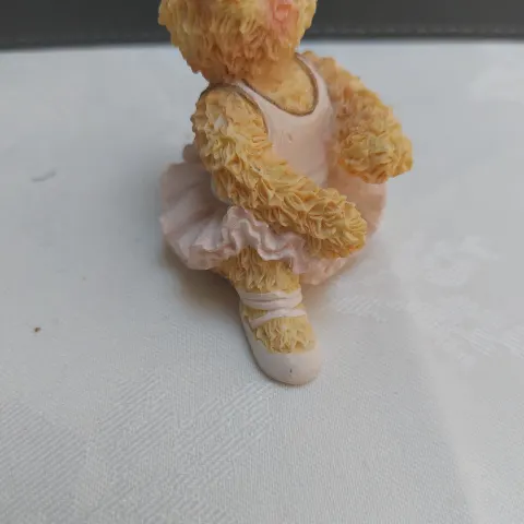 Sitting down ballerina