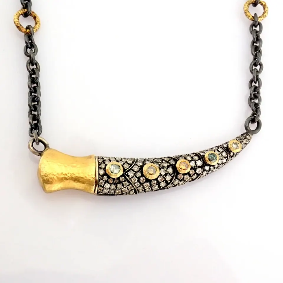 An Exquisite Sword Necklace Detailed With Brilliant Diamonds and Gold On Silver