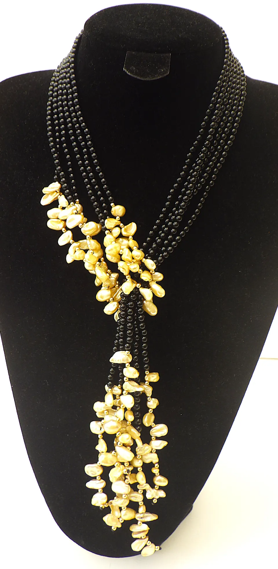 "Lariat" With Three Long Strands With Black Onyx and Champagne Coloured Natural Keshi Pearls