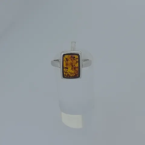 Silver ring set with natural amber stone