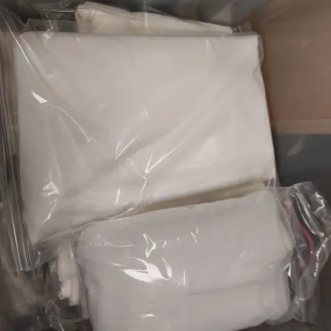 Quantity of ivory or white fabric bundles