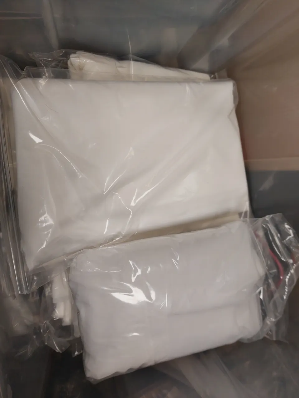 Quantity of ivory or white fabric bundles