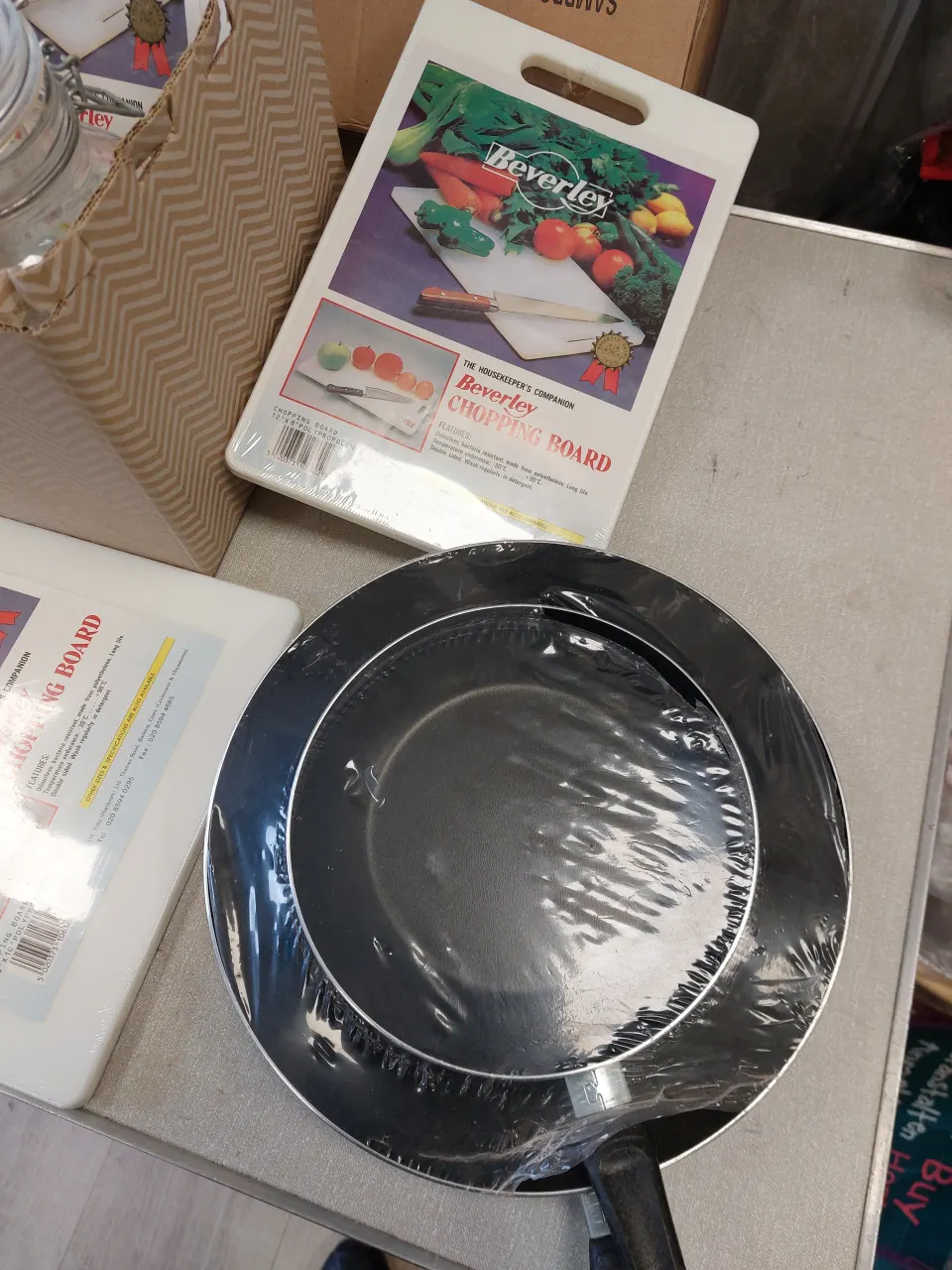 Catering items chopping boards frying pans bowls and jars