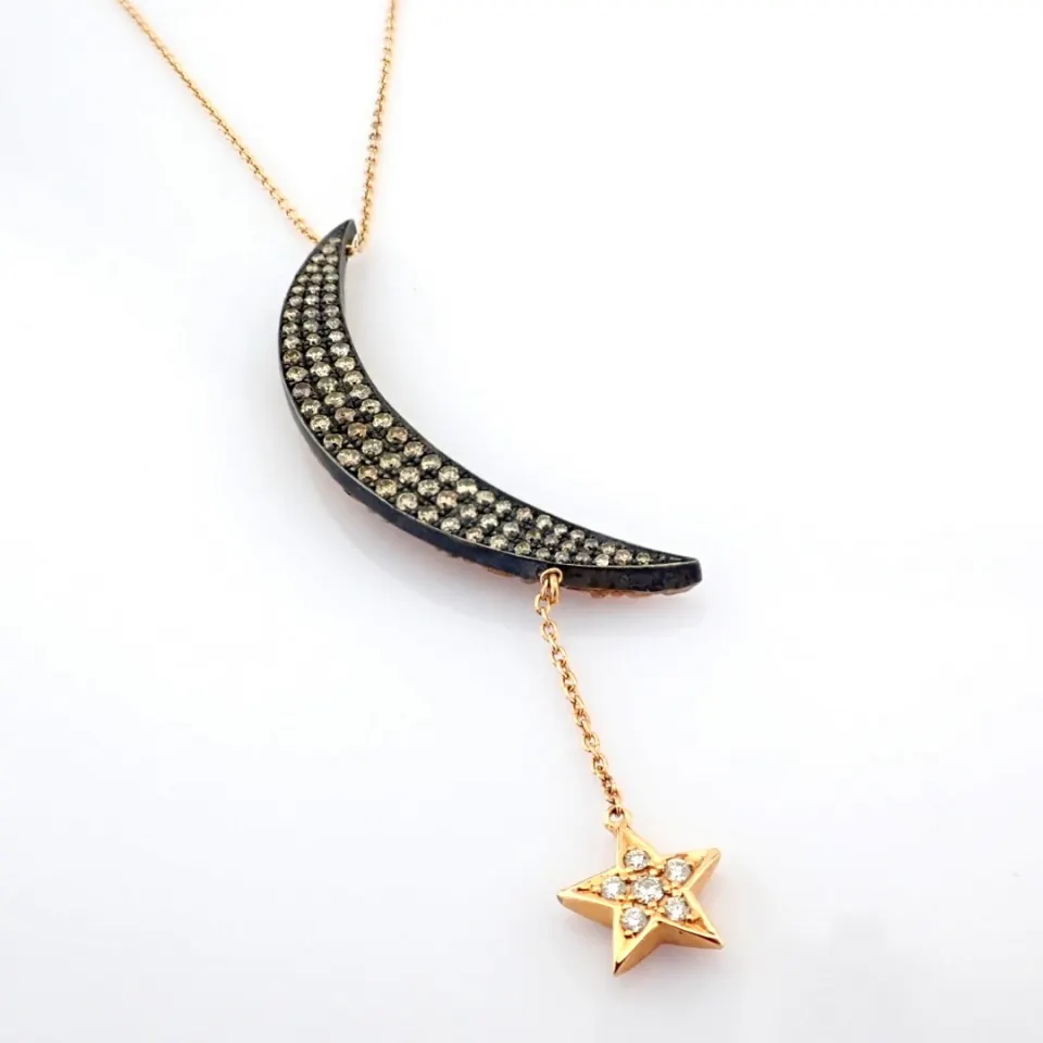 An Exquisite Carrie's Moon Necklace Intricately Detailed With Brilliant Diamonds and Gold On Silver.