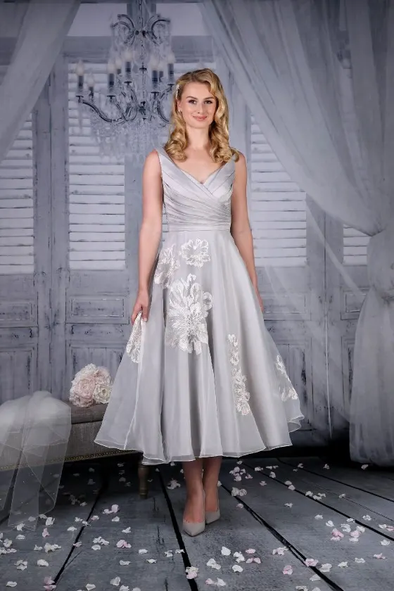 Tea length wedding or special occasion dress in size 18 to 20. Platinum organza fabric.  RRP £395