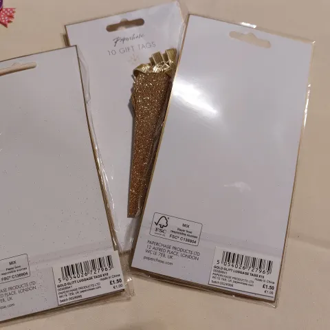 Gold glittery tags/labels.  Packs of 10.  Box of 120 packs Total RRP £180