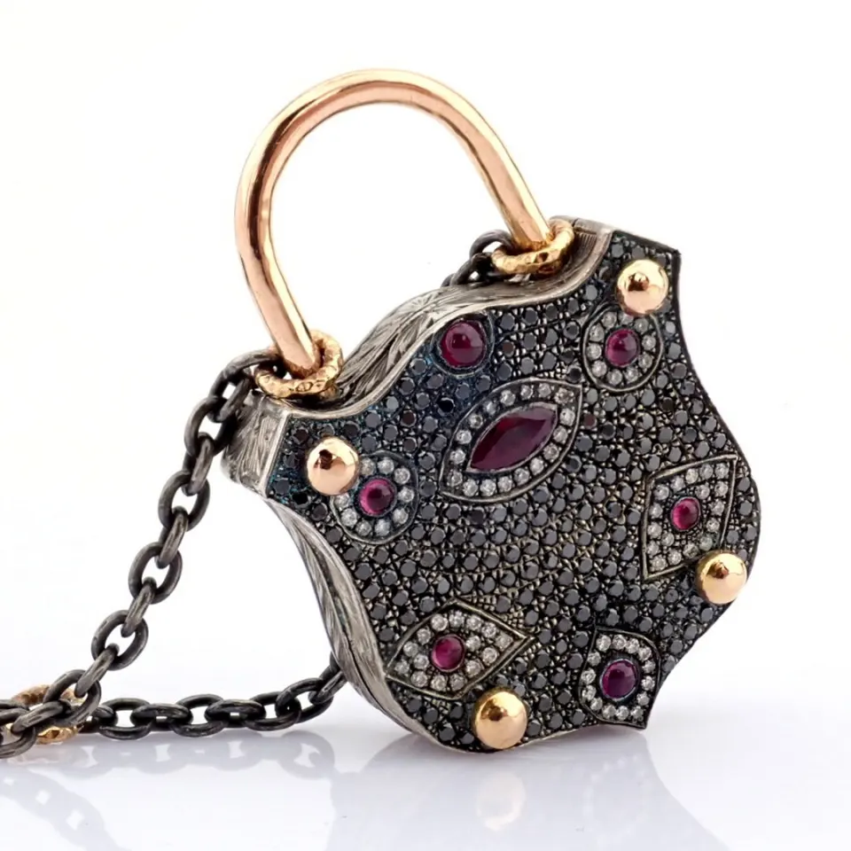 Convertible clasp necklace embellished with gold, colorful stones, and diamonds on silver