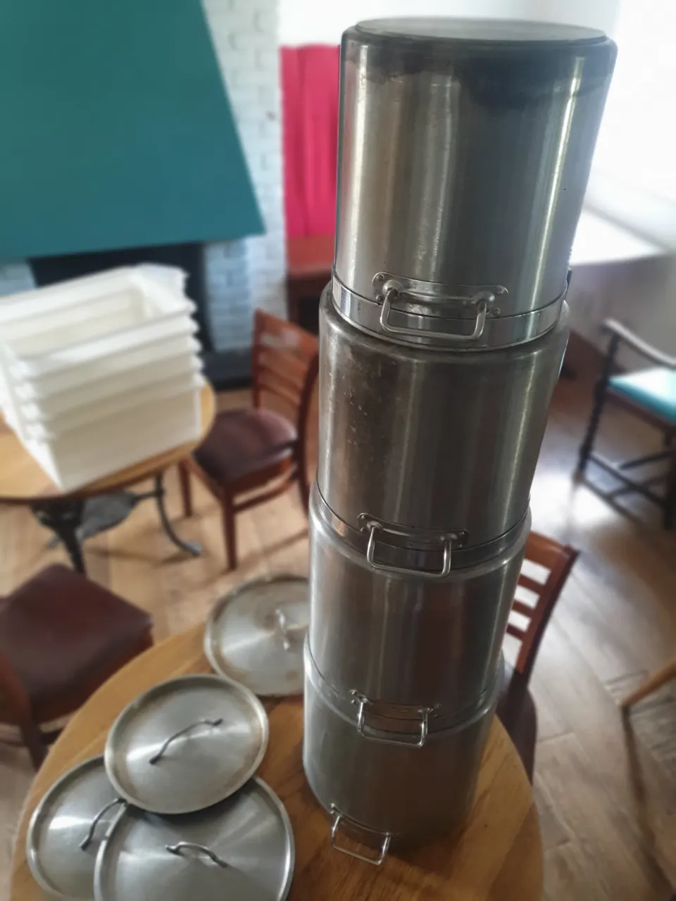 A set of 4 heavy base tall stainless steel pots with lids