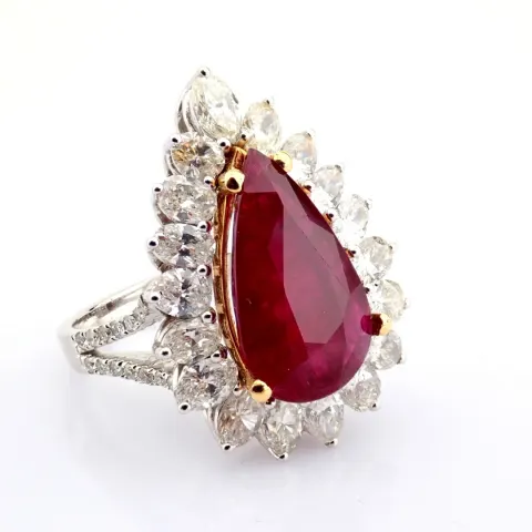 A luxurious 18K white gold cluster ring detailed with 5.46 ct Ruby and 2.76 ct brilliant diamonds