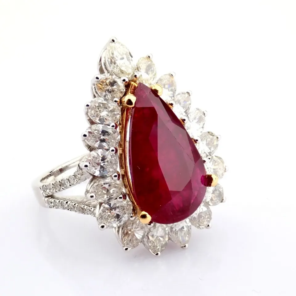 A luxurious 18K white gold cluster ring detailed with 5.46 ct Ruby and 2.76 ct brilliant diamonds