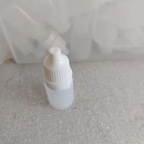 Plastic bottles mini with stoppers and tops