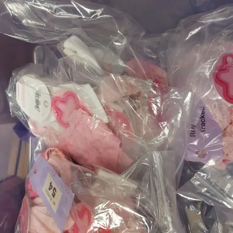 Box of children's pink and white hair accessories