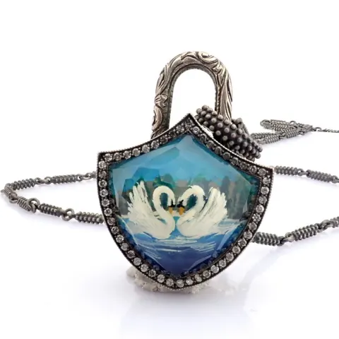 Clasp necklace embellished with gold, topaz, reversaly engraved intaglio swan and diamonds on silver