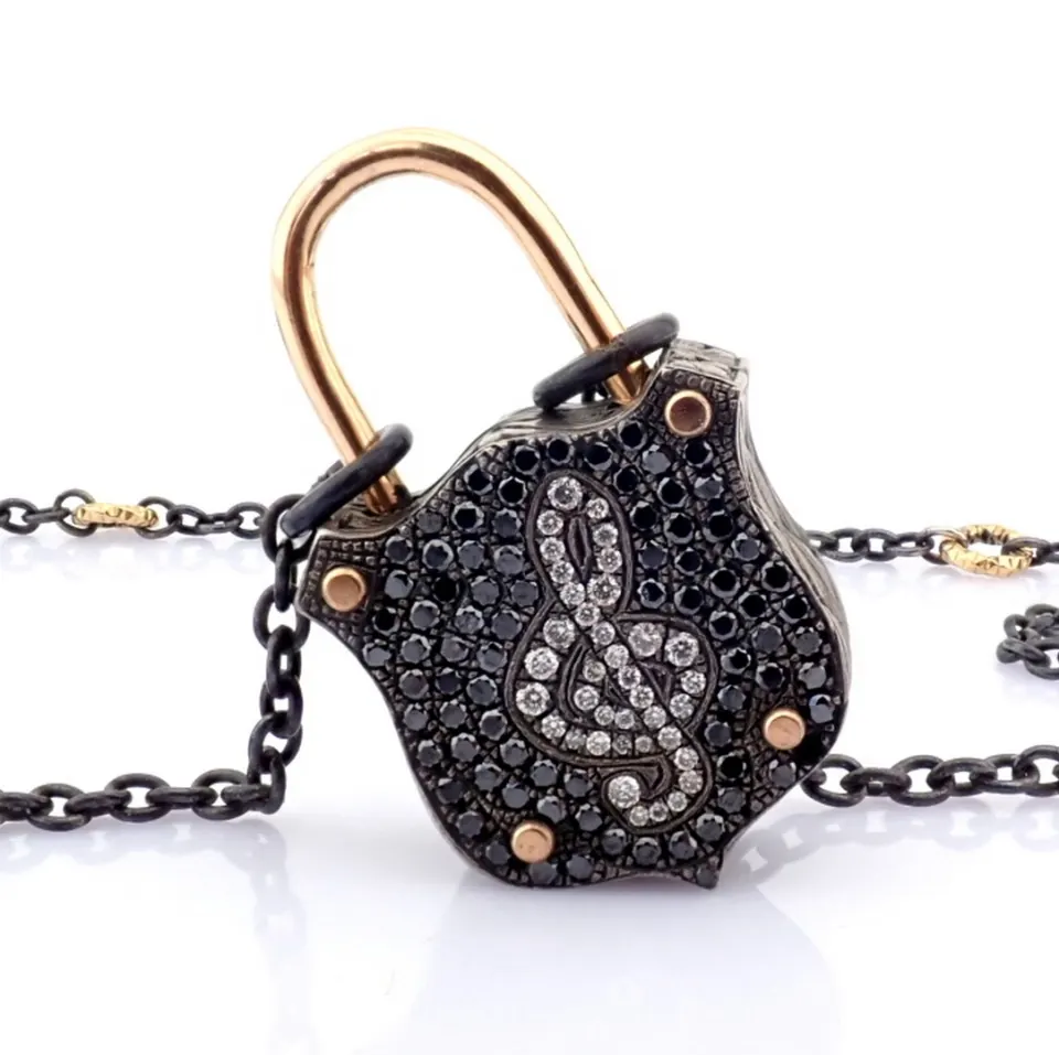 An Exquisite, Convertible Clasp Necklace Embellished With Gold and Diamonds On Silver