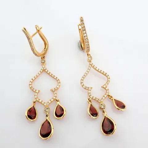 18K rose gold earrings detailed with red garnet, brilliant diamonds