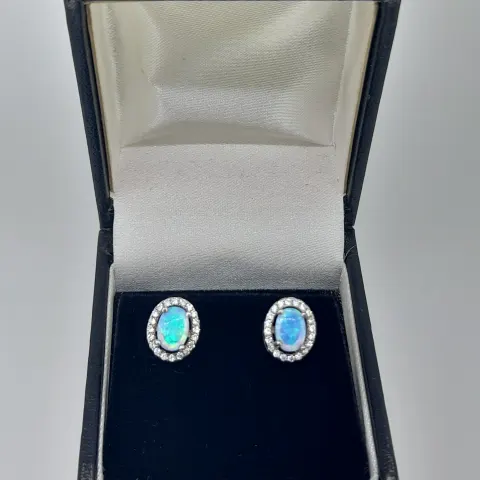 Silver and Synthetic Opal Stud Earring With CZ Halo