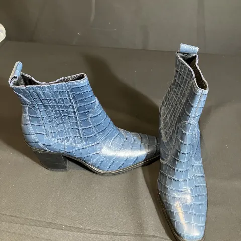 M & S Croc boots worn by a body double