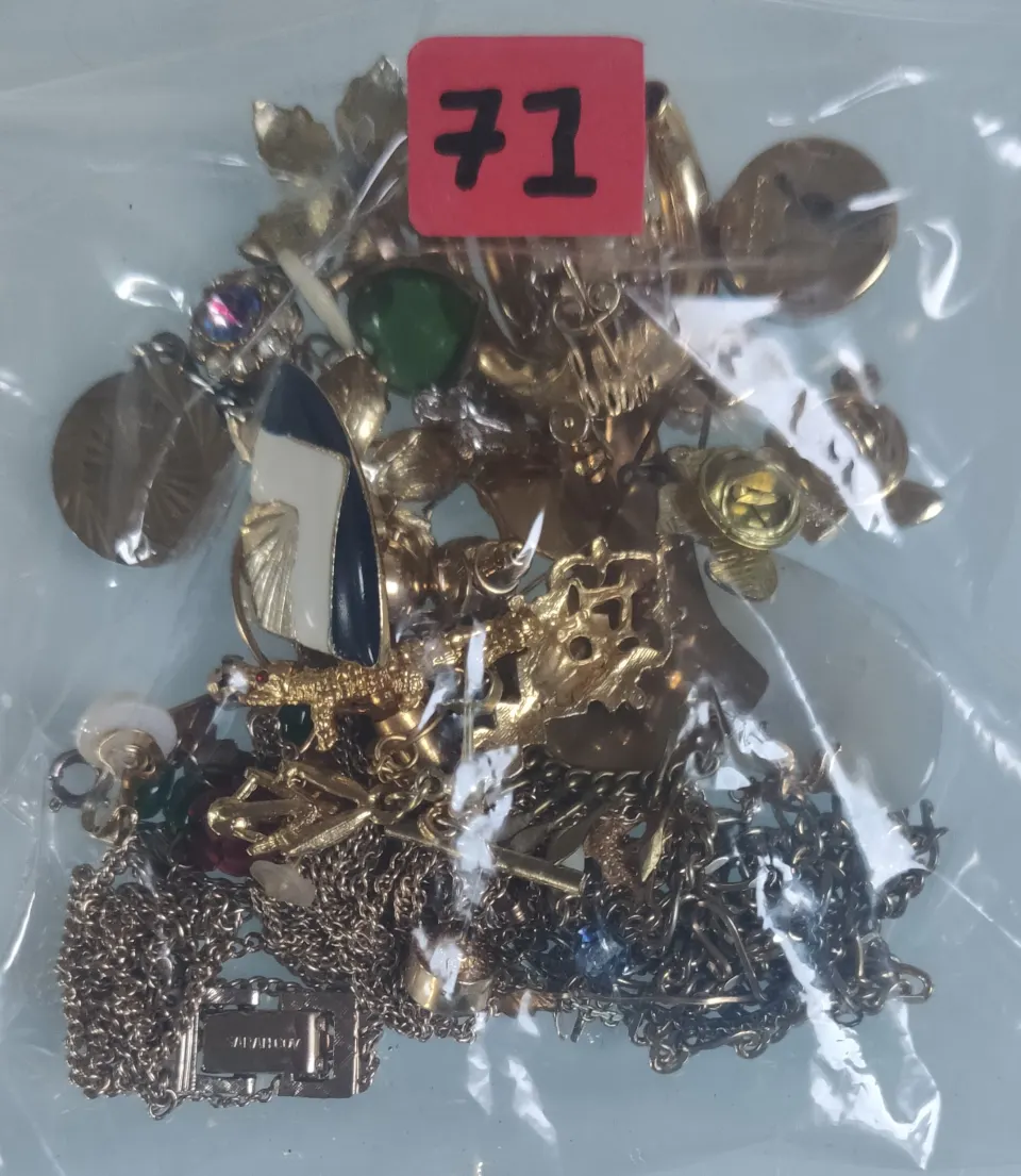 A collection of yellow metal jewellery in a bag. Approximately 125g