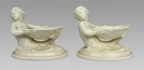Pair of Royal Worcester Blanc de Chine Merchild Salt Cellars