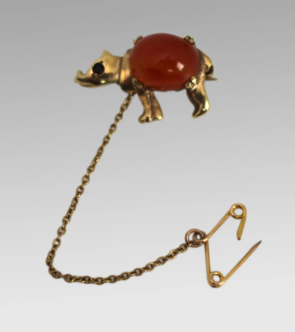 Gold Rhino Form Brooch with Carnelian & Ruby Eyes