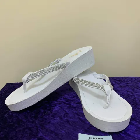 Selection of white toe post shoes