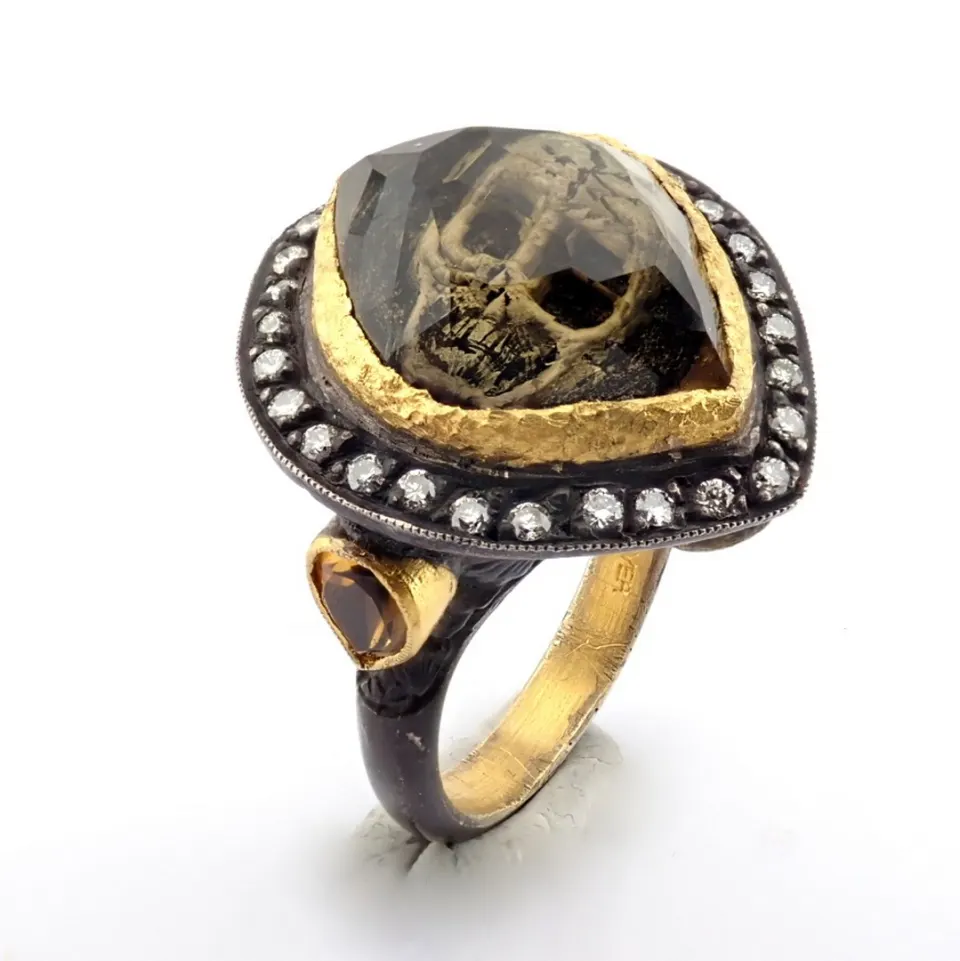 Hand-made ring with reversaly engraved intaglio skull, topaz , brilliant diamonds and gold in silver