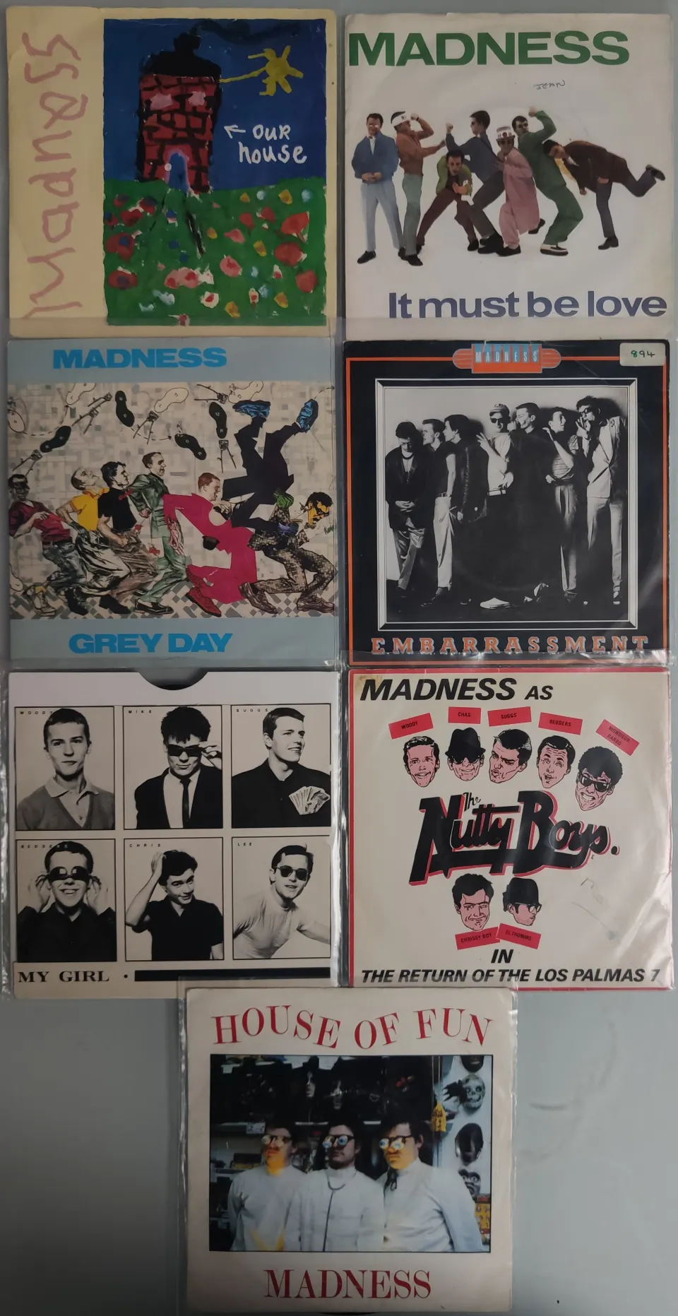 A Collection of 7x Madness 7” Vinyl Singles In Mainly VG+ Condition