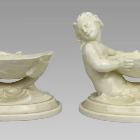 Pair of Royal Worcester Blanc de Chine Merchild Salt Cellars