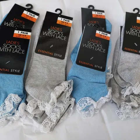 Box of ladies socks grey, blue and black.  24 pairs in box