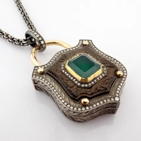 An Exquisite, Convertible Clasp Necklace Embellished With Gold, Vibrant Emerald, Ebony-Carved and Di