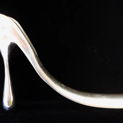A Limited Edition Large Aluminium Ornamental Shoehorn By Designer Manolo Blahnik