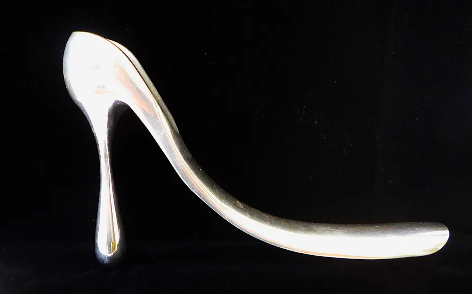 A Limited Edition Large Aluminium Ornamental Shoehorn By Designer Manolo Blahnik