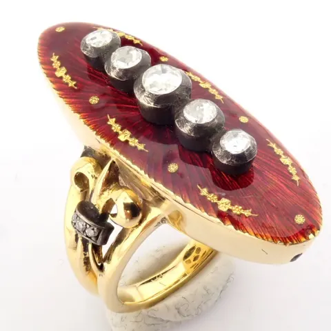 An exquisite ring detailed with red enamel, brilliant diamonds and gold on silver