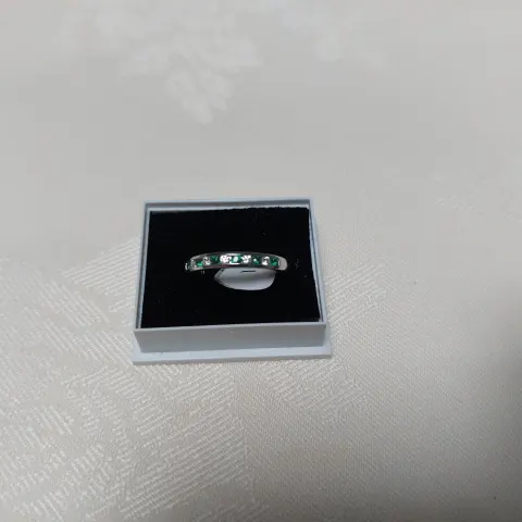 Silver eternity/wedding band with blue and green coloured cz  stones size N.  RRP £189 199
