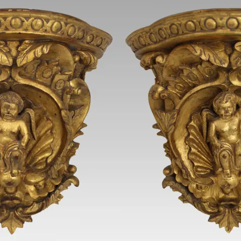 Pair of Carved Giltwood Wall Brackets with Cherub Motifs