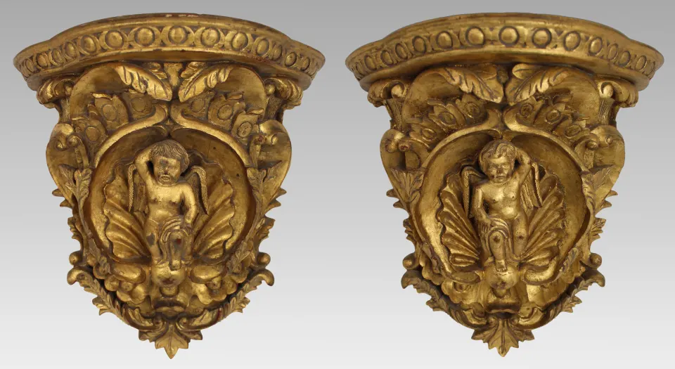 Pair of Carved Giltwood Wall Brackets with Cherub Motifs