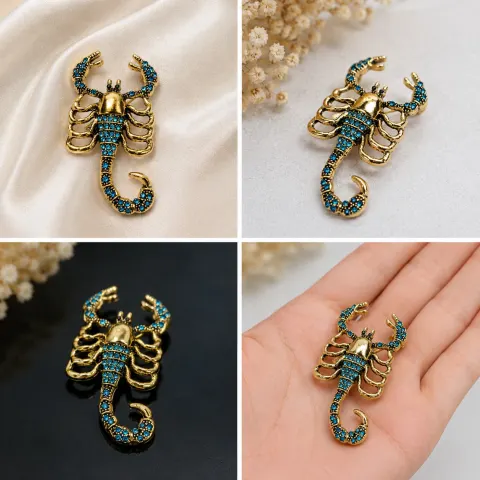 Gold-Tone Scorpion Brooch with Blue Crystal Accents