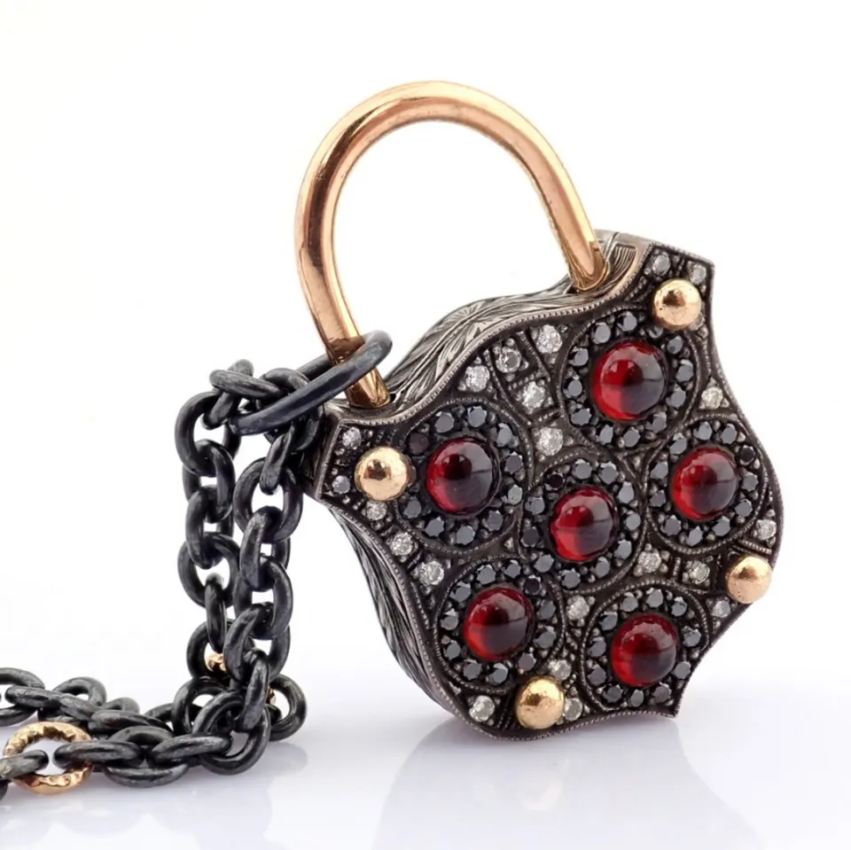 Convertible clasp necklace embellished with gold, colorful stones, and diamonds on silver