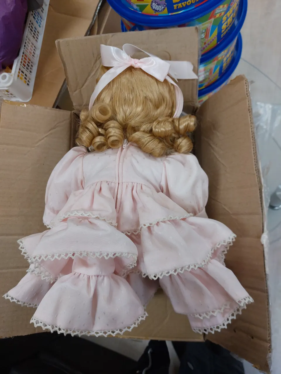 Vintage doll in pink dress