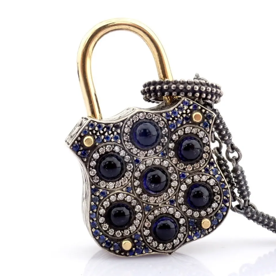 Convertible clasp necklace embellished with gold, colorful stones, and diamonds on silver
