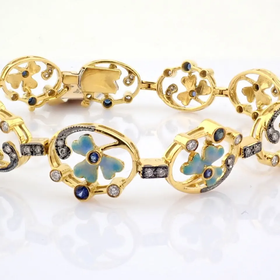 18K yellow gold bracelet detailed with emerald, sapphire and brilliant diamonds