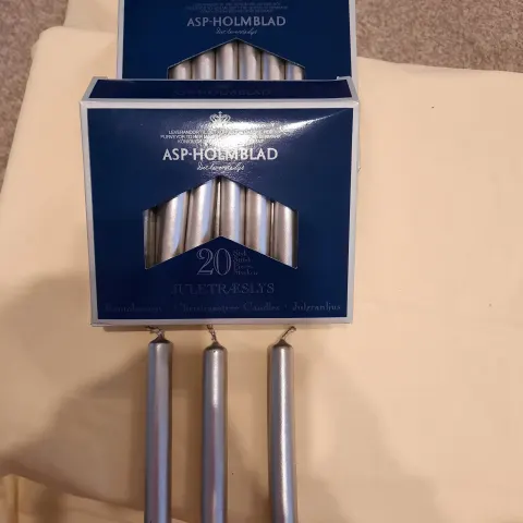 4 x packs small silver candles plus pack of longer candles