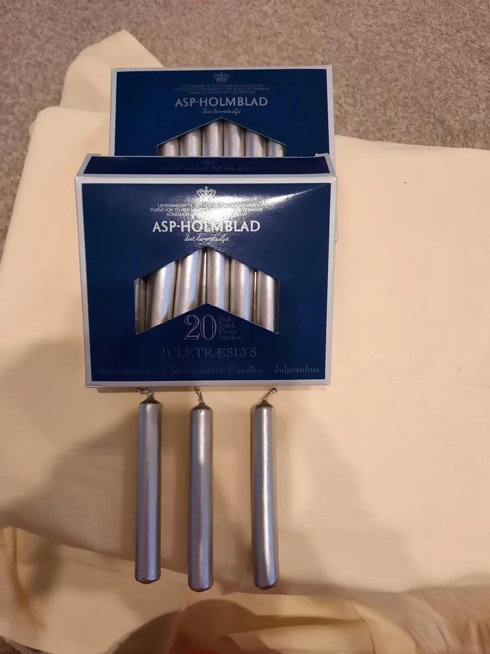 4 x packs small silver candles plus pack of longer candles