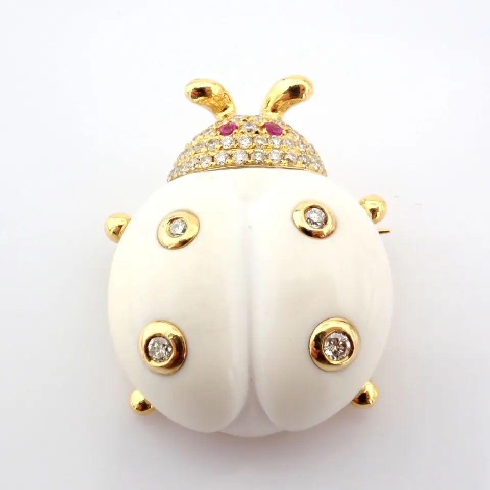 An exquisite agate ladybird pendant or brooch detailed with brilliant diamonds and gold