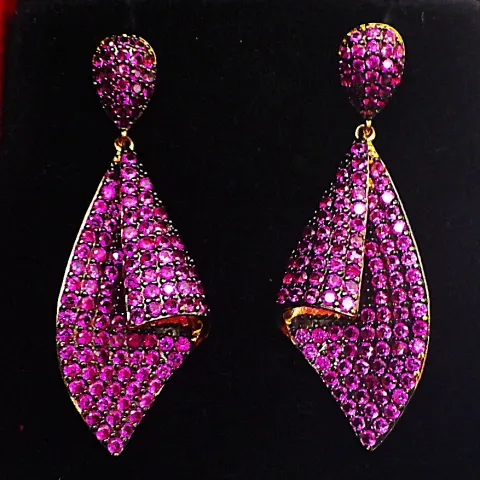 A Pair of Gilded Earrings Loaded With Lab Created Round Cut Rubies