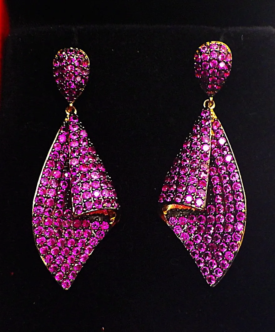 A Pair of Gilded Earrings Loaded With Lab Created Round Cut Rubies