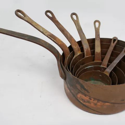 Set of 7 Graduated Copper Saucepans