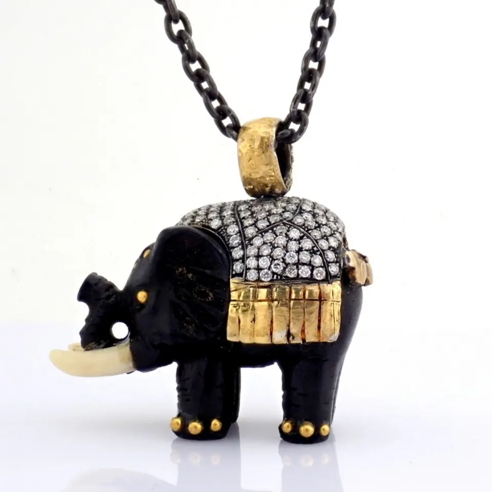 An Ebony-Carved Elephant Necklace Intricately Detailed With Brilliant Diamonds and Gold On Silver.
