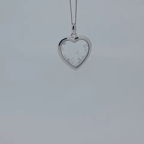 Silver Heart Shaped Pendant With Floating Stones