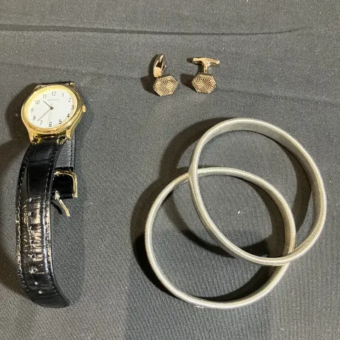 Fred Bennett cufflinks and watch worn by Mark Fleischmann